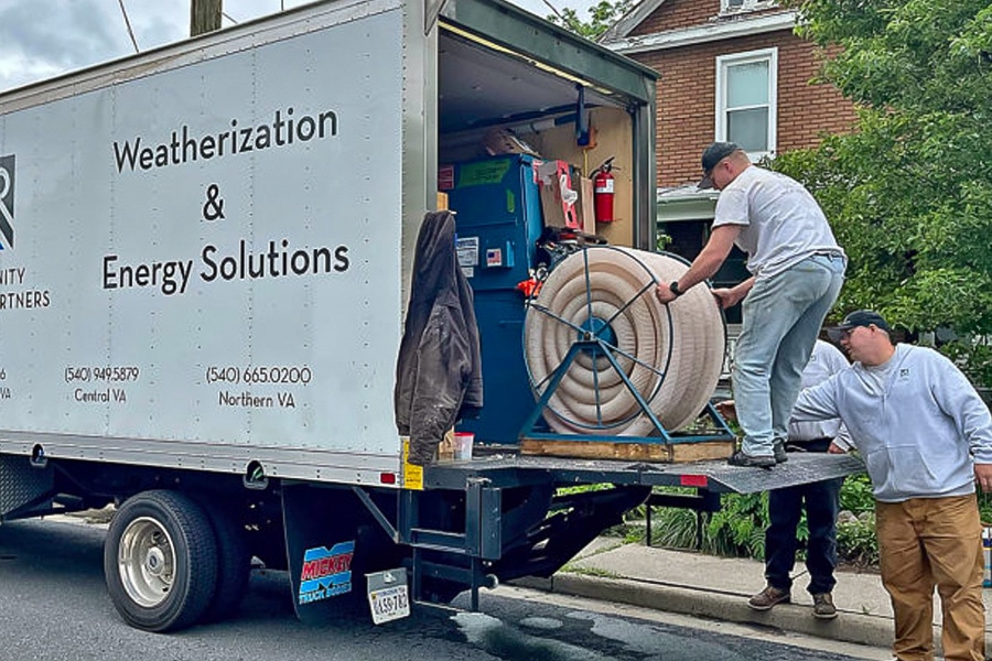 CHP Weatherization and Energy Solutions unloading equipment from a truck