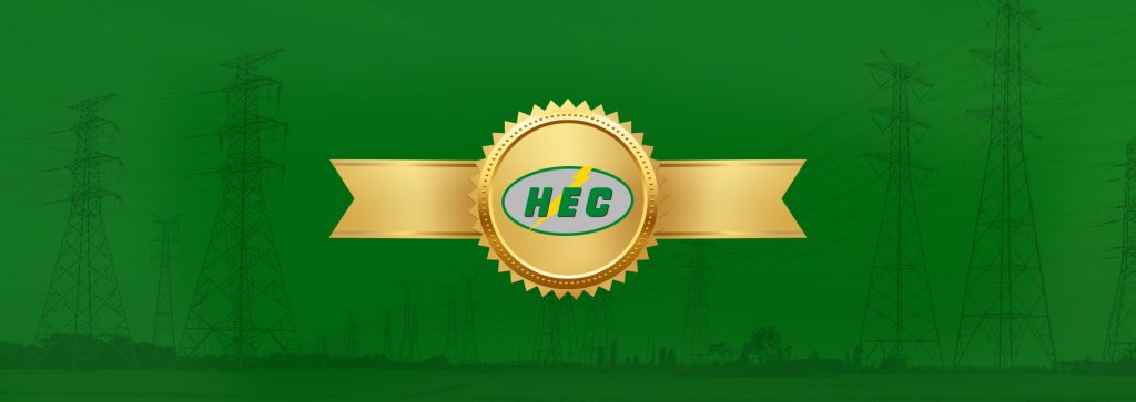 HEC logo on a gold ribbon in front of power lines.